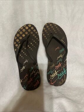 Reef Women’s Brown Flip Flops with Multicolor Script